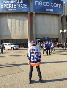 person wearing a Cizikas jersey outside the arena