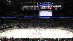 packed arena with a hockey game 